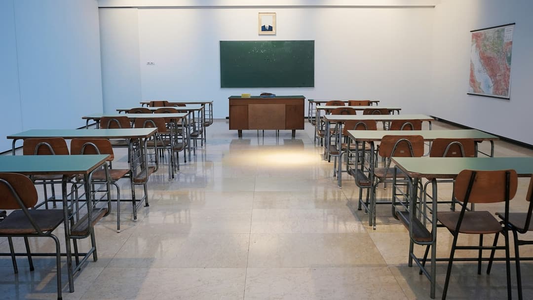 Modern library interior with high ceilings and focused students studying